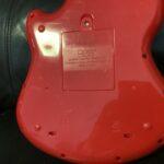 Little Learner Rock & Spin Guitar (also sold under brands like Hap-p-kid or Fat Brain Toys).