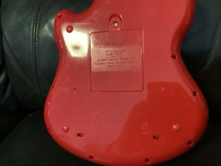 Little Learner Rock & Spin Guitar (also sold under brands like Hap-p-kid or Fat Brain Toys).
